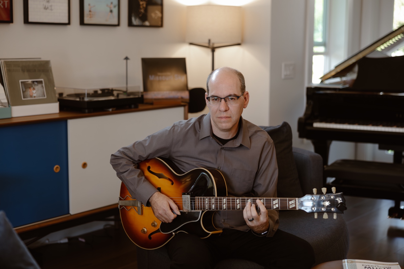 Marc Schonbrun holding an archtop jazz guitar